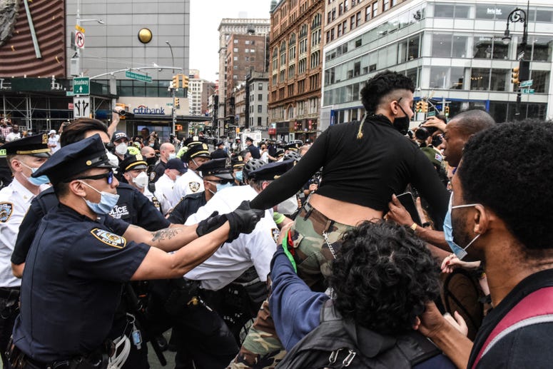 A protester is detained by police during a rally against the death of Minneapolis, Minnesota man George Floyd at the hands of police on May 28, 2020 in Union Square in New York City. NYC protest