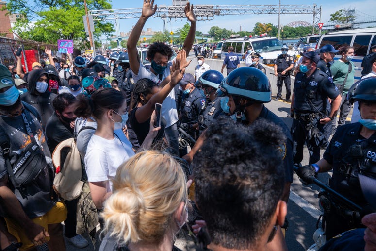 Police confront protesters after taking over the F.D.R. Drive in Harlem on May 30, 2020 in New York City. NYC protest