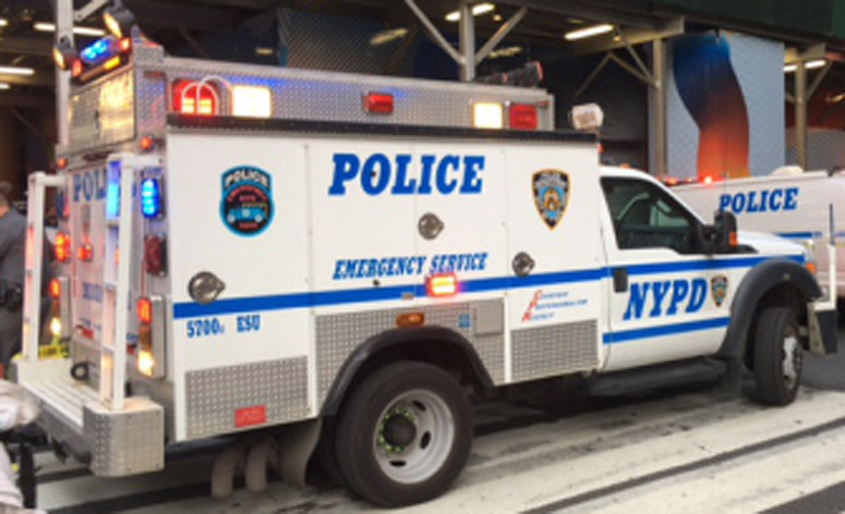 An NYPD vehicle sits on a city street. An NYPD vehicle sits on a city street.