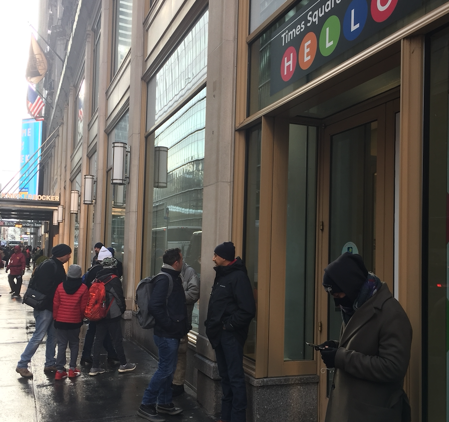 Customers line up outside Times Square Toys R Us