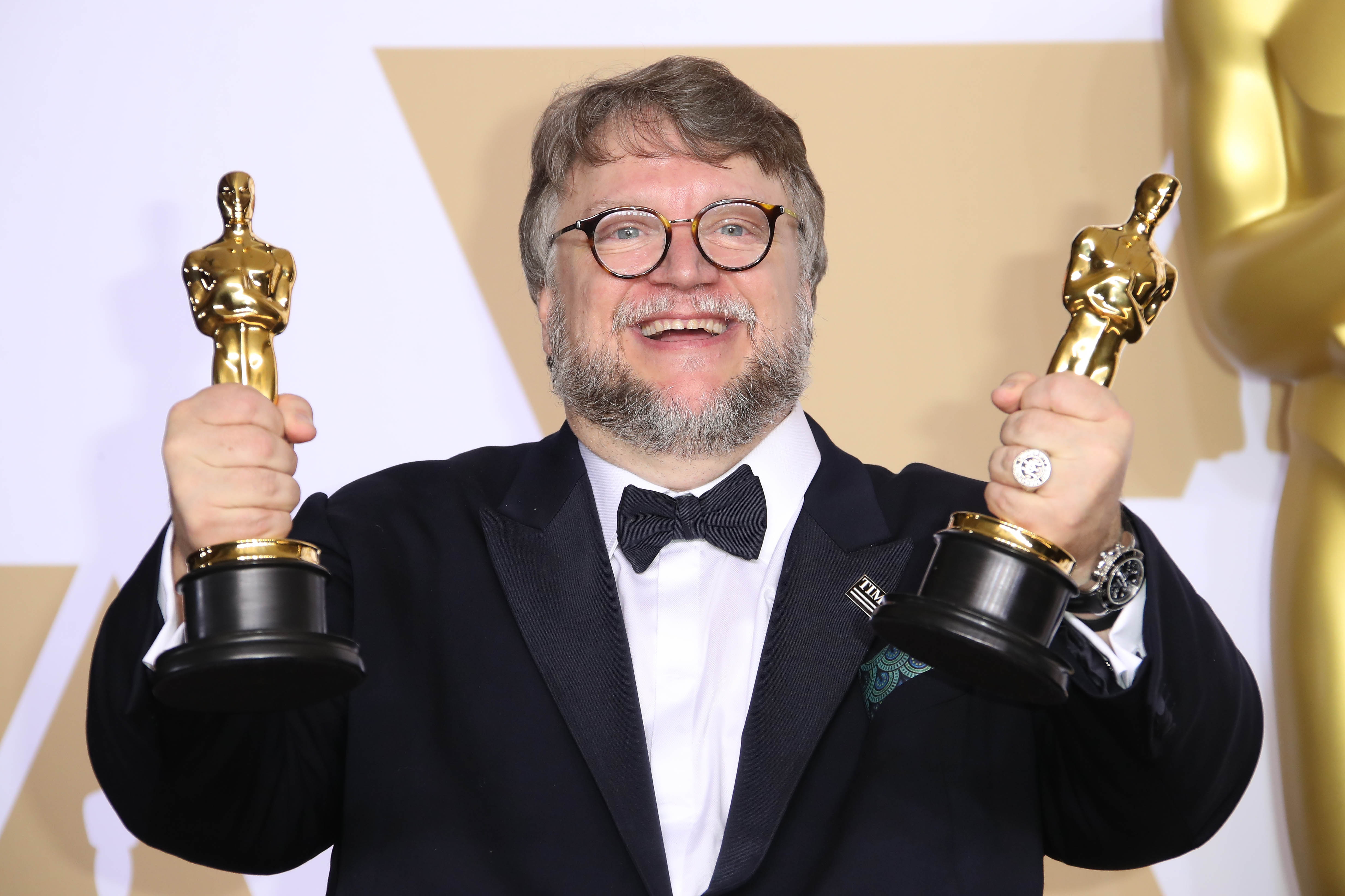 March 4, 2018; Hollywood, CA, USA; Guillermo del Toro poses with his awards for Best Picture for Best Director for The Shape of Water in the photo room during the 90th Academy Awards at Dolby Theatre. March 4, 2018; Hollywood, CA, USA; Guillermo del Toro poses with his awards for Best Picture for Best Director for The Shape of Water in the photo room during the 90th Academy Awards at Dolby Theatre.
