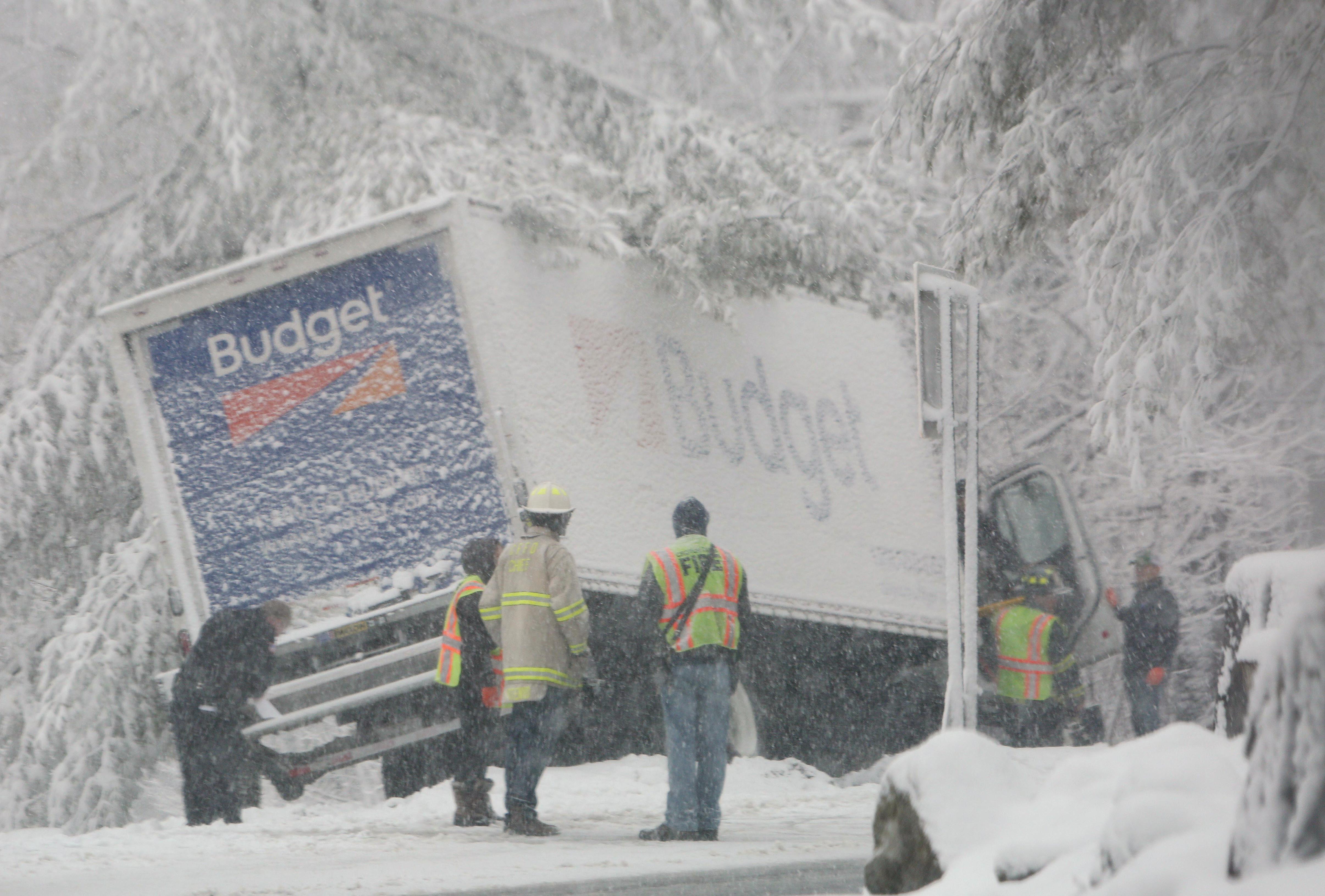Croton Falls firefighters assist an injured driver after his truck went off of Route 121