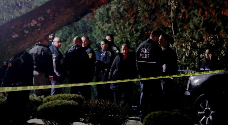 Police gather outside the home of a rabbi on Forshay Road in Monsey, N.Y. Sunday night after a man entered the house and stabbed multiple people who were there for a Hanukkah gathering. Monsey stabbing