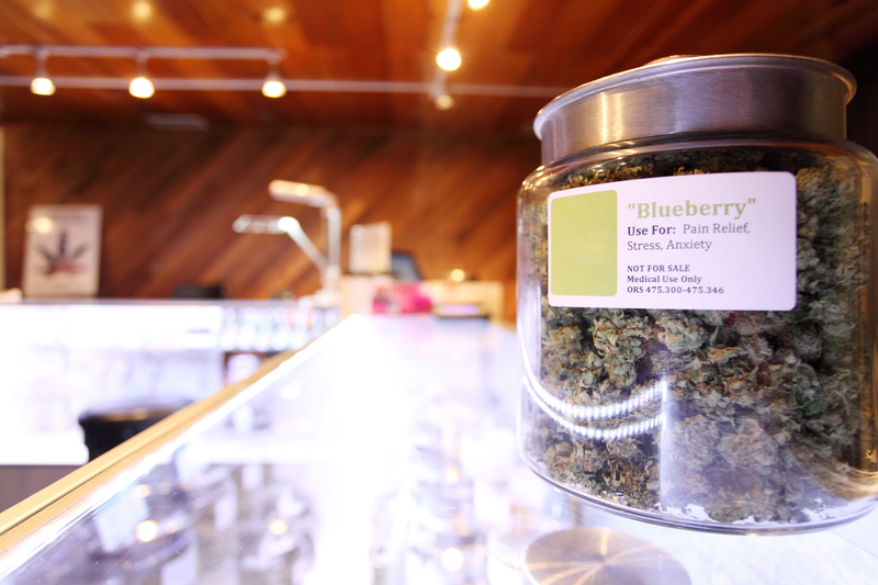 Medical marijuana in large jar at a legal marijuana dispensary. Medical marijuana in large jar at a legal marijuana dispensary.