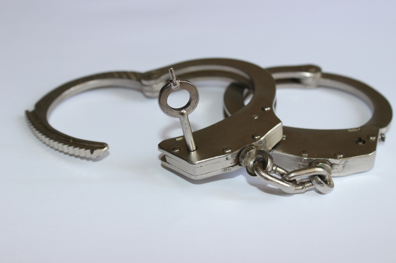 A pair of handcuffs. A pair of handcuffs.