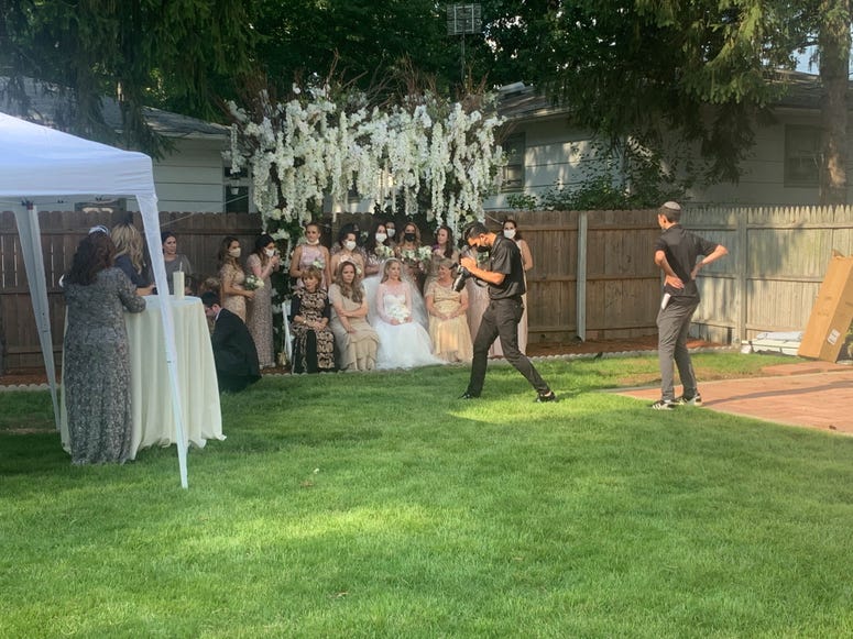 Attendees gather before the wedding. Ashley and Israel