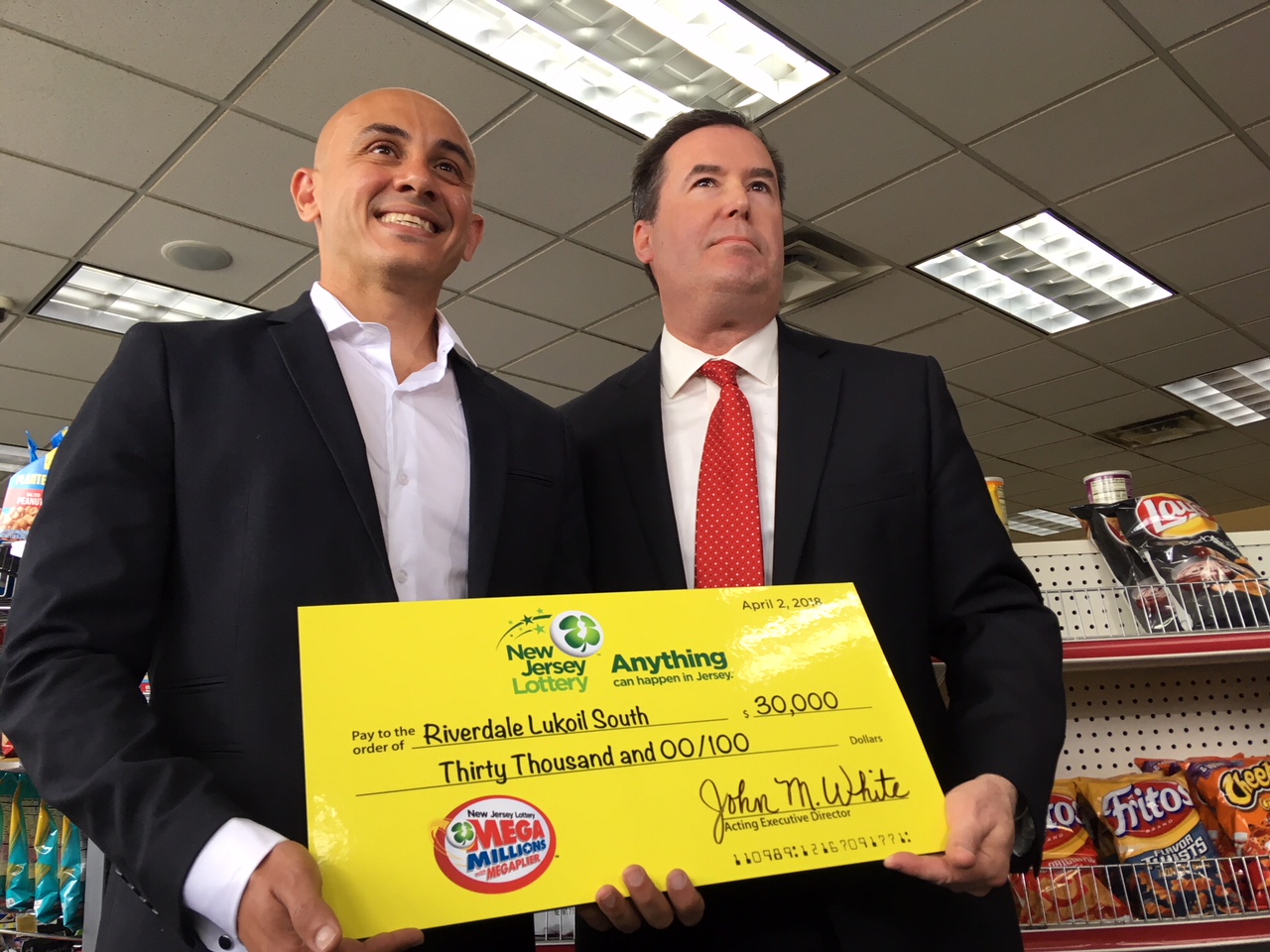 NJ Lottery's John White gives check to Ameer Krass