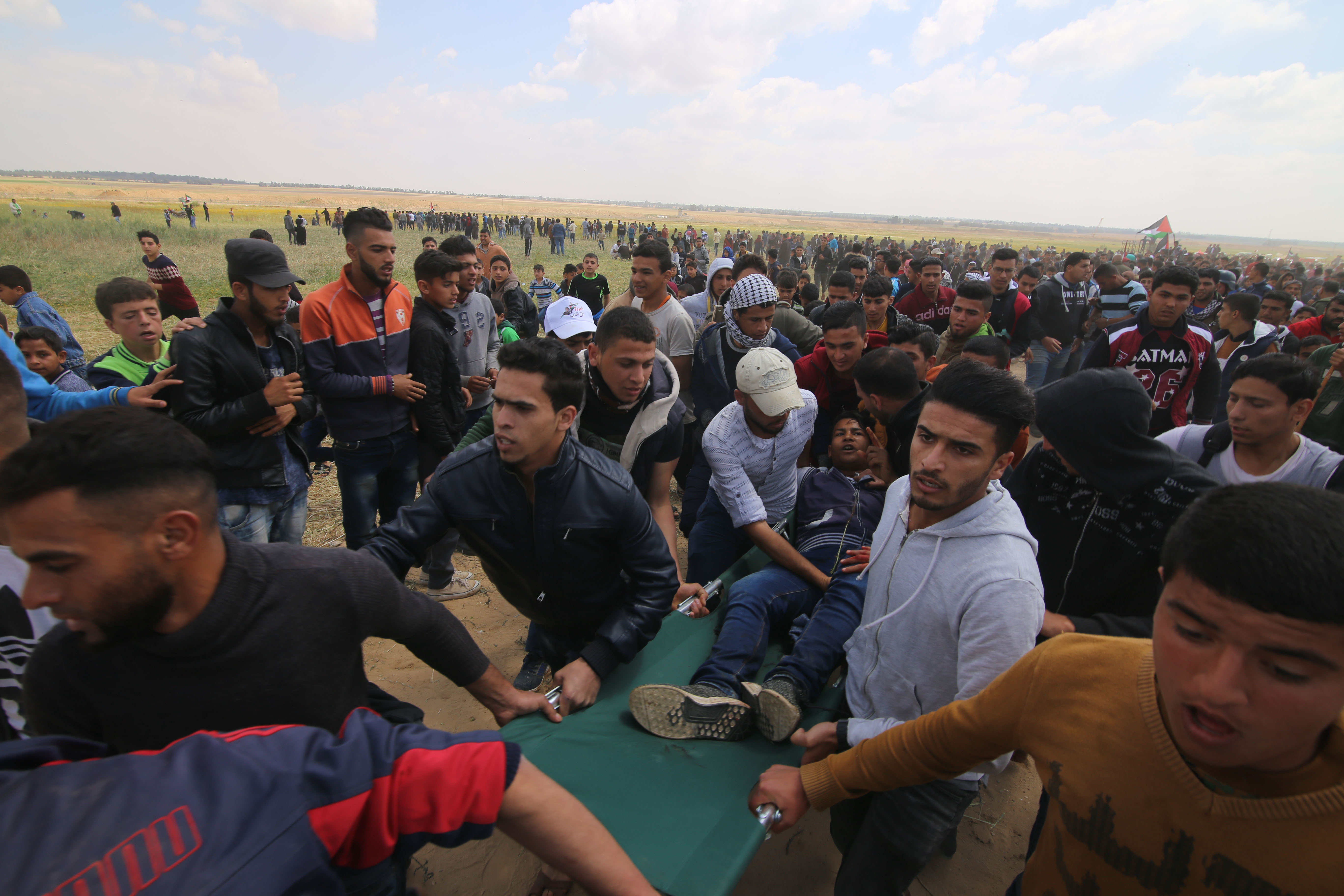 GAZA, March 30, 2018 (Xinhua) -- A wounded Palestinian is evacuated during clashes with Israeli troops near the Gaza-Israel border in the southern Gaza Strip City of Khan Younis, on March 30, 2018. At least seven Palestinians were killed and 500 wounded F GAZA, March 30, 2018 (Xinhua) -- A wounded Palestinian is evacuated during clashes with Israeli troops near the Gaza-Israel border in the southern Gaza Strip City of Khan Younis, on March 30, 2018. At least seven Palestinians were killed and 500 wounded F