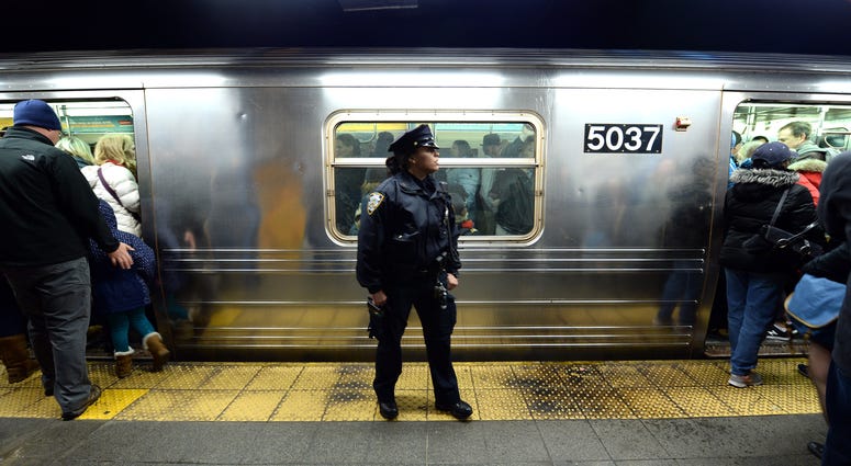An NYPD officer in the subway. NYPD subway