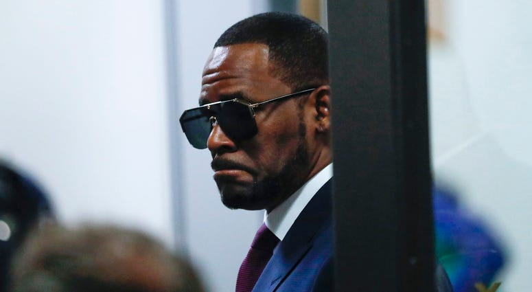 R. Kelly arrives at the Daley Center in Chicago to attend a closed-door hearing in a court fight with his ex-wife over child support on Wednesday, March 13, 2019. R. Kelly