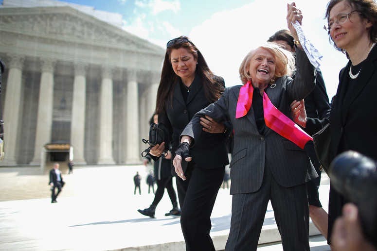 Edith Windsor (C), 83, acknowledges her supporters as she leaves the Supreme Court March 27, 2013 in Washington, DC. (Photo by Chip Somodevilla/Getty Images)