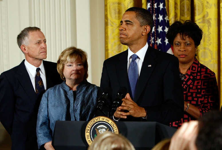 U.S. President Barack Obama (2R) delivers remarks on the enactment of the "Matthew Shepard and James Byrd, Jr. Hate Crimes Prevention Act" in the East Room of the White House October 28, 2009. (Photo by Win McNamee/Getty Images)