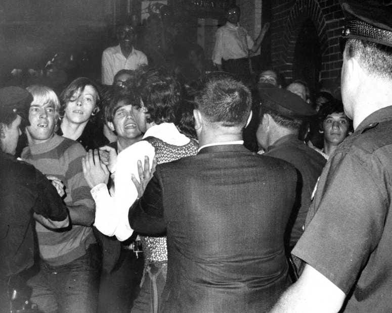 JUNE 28, 1969: Stonewall Inn nightclub raid. Crowd attempts to impede police arrests outside the Stonewall Inn on Christopher Street in Greenwich Village. (Photo by NY Daily News Archive via Getty Images)