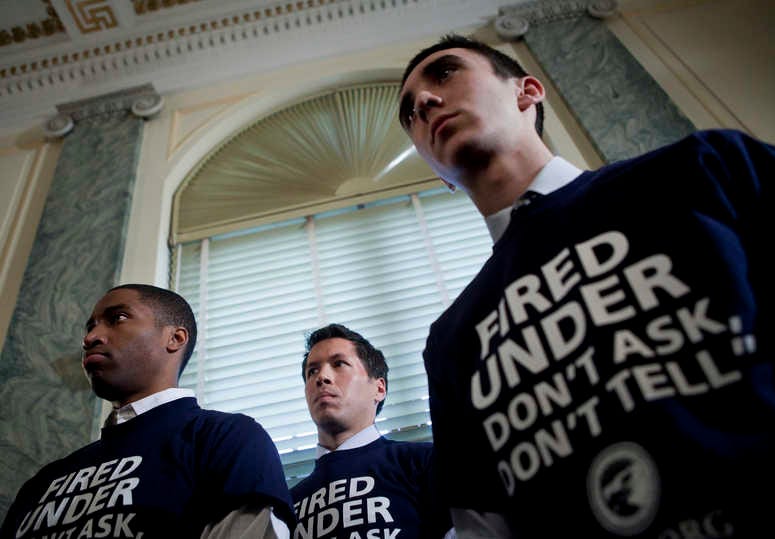 Former service members Anthony Woods, of Viginia, Stacy Vasquez, of Texas, and Todd Belok, of Connecticut, listen during a news conference on Capitol Hill March 3, 2010 in Washington, DC. (Photo by Brendan Smialowski/Getty Images)