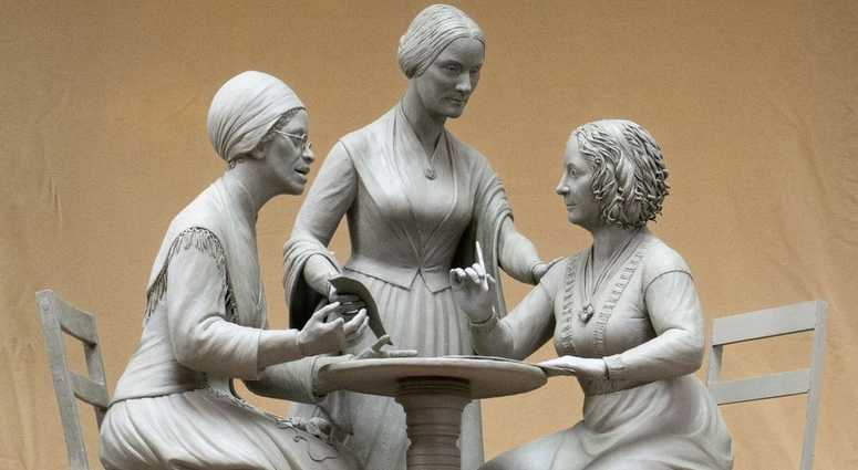 This Oct. 6, 2019 photo provided by Michael Bergmann shows a one-third scale clay model of Sojourner Truth, left, Susan B. Anthony, center, and Elizabeth Cady Stanton at Meredith Bergmann's studio in Ridgefield, Conn