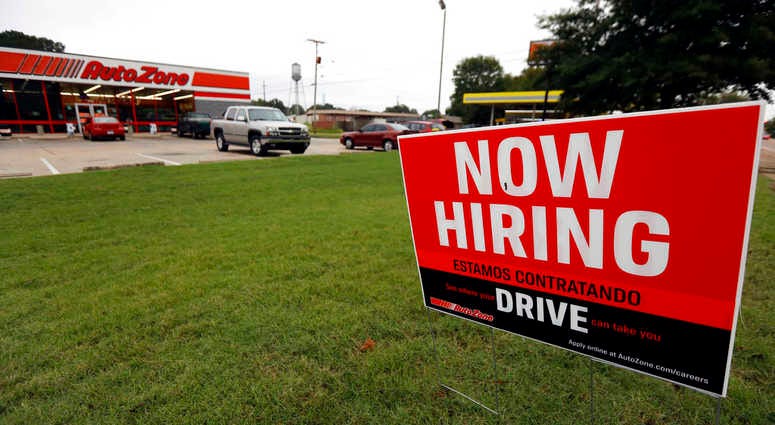 Bilingual help wanted sign for Auto Zone