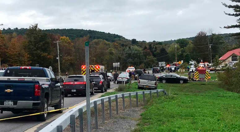 In this Saturday, Oct. 6, 2018 photo, emergency personnel respond to the scene of a deadly crash in Schoharie, N.Y. Limo Crash
