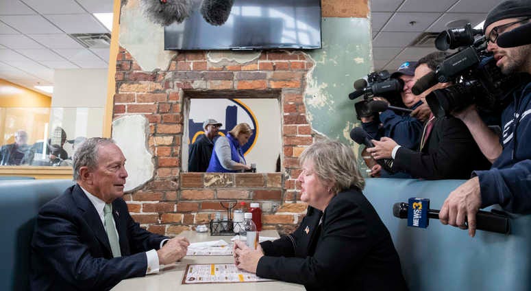 Newly announced Democratic presidential candidate, former New York Mayor Michael Bloomberg meets with Virginia House Delegate-Elect Nancy Guy at a coffee shop on November 25, 2019 in Norfolk, Virginia.
