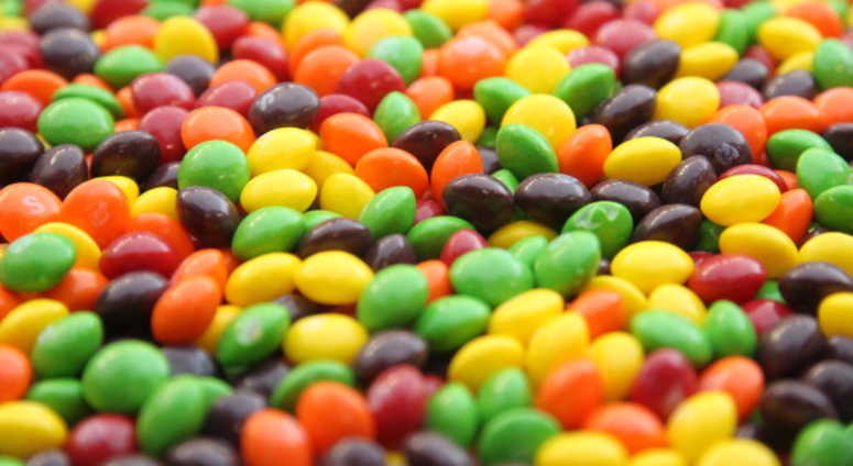 A closeup of a bowl of Skittles. A closeup of a bowl of Skittles.