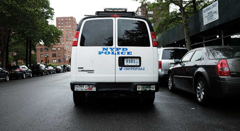 A New York City Police Department (NYPD) van is parked near housing projects in the Brownsville section of Brooklyn NYPD in Brownsville