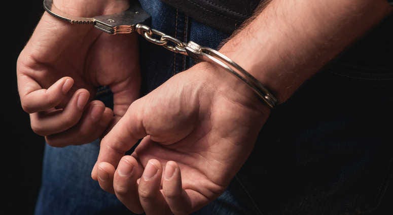 Handcuffed man Handcuffed man