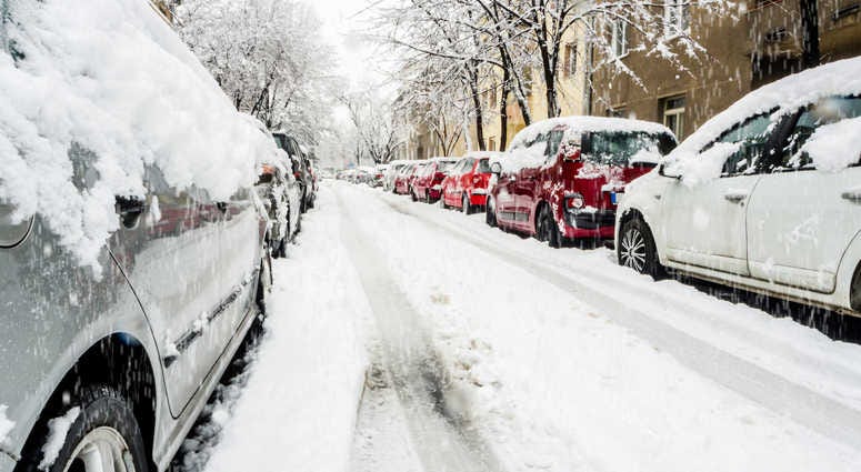 Cars on a snowy city street