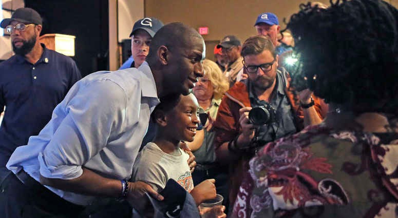 Tallahassee mMayor Andrew Gillum poses for a photo with a young fan during a campaign stop in his bid for governor, Monday, Nov. 5, 2018, in Crawfordville, Fla. Tallahassee mMayor Andrew Gillum poses for a photo with a young fan during a campaign stop in his bid for governor, Monday, Nov. 5, 2018, in Crawfordville, Fla.