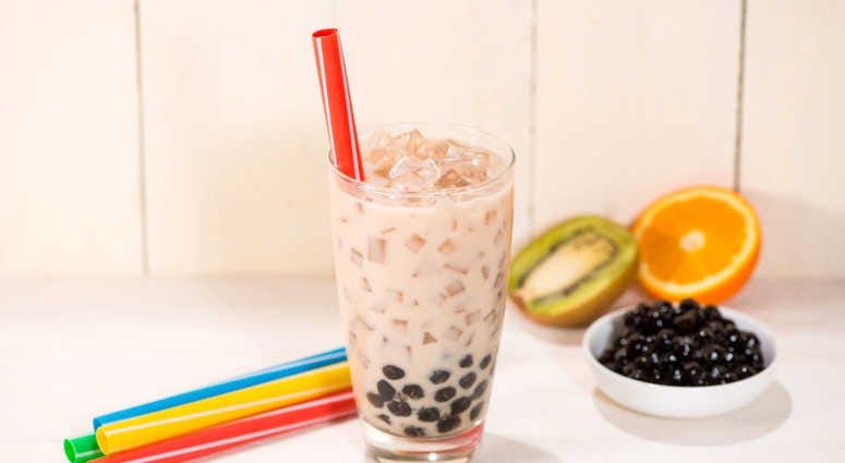 A glass of bubble tea with milk