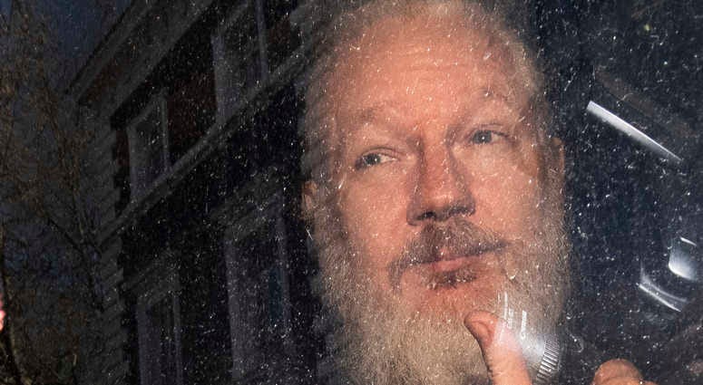 Julian Assange after his arrest Thursday. Julian Assange