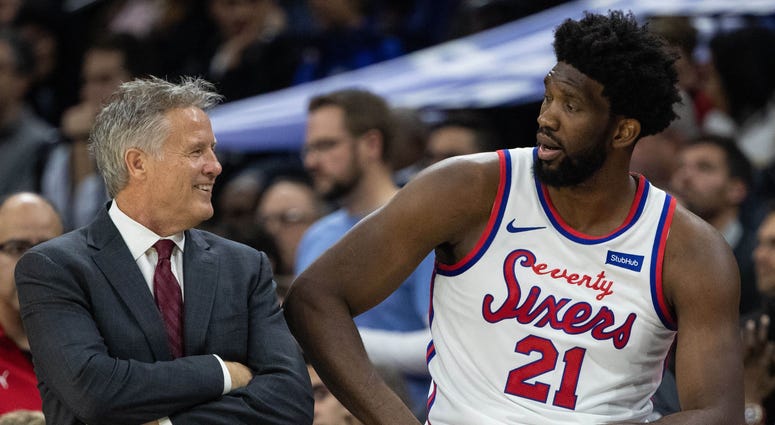 Brett Brown and Joel Embiid Brett Brown and Joel Embiid