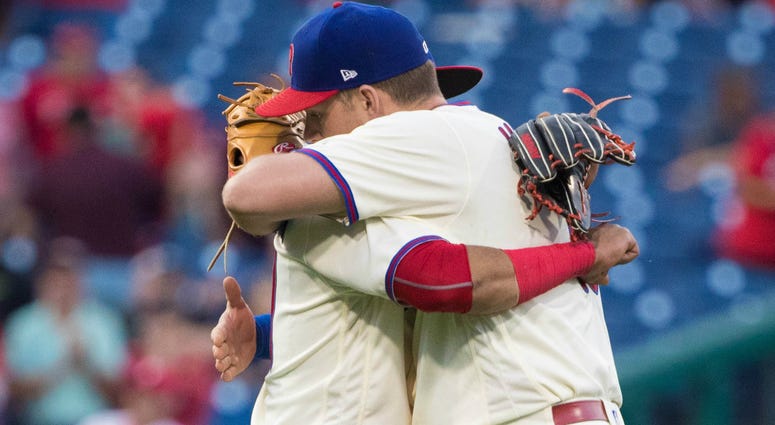 Rhys Hoskins Rhys Hoskins hugs Carlos Santana
