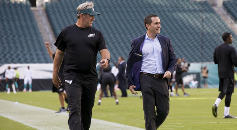 Doug Pederson walks with Howie Roseman Doug Pederson and Howie Roseman