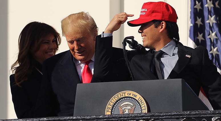 Nationals catcher Kurt Suzuki surprises President Trump by breaking out a 'Make America Great Again' hat during the Nats' White House ceremony Kurt Suzuki White House