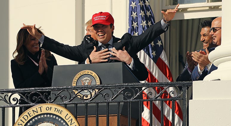 Nationals catcher Kurt Suzuki surprises President Trump by breaking out a 'Make America Great Again' hat during the Nats' White House ceremony Kurt Suzuki Trump