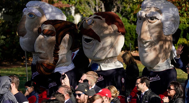 The Racing Presidents stand in a see of Nationals fans in attendance to watch the World Series champion Nationals honored at the White House Racing Presidents – Nationals' White House Visit