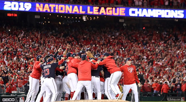 The Nationals rush the field after beating the Cardinals in Game 4 of the NLCS 2019 National League Champions