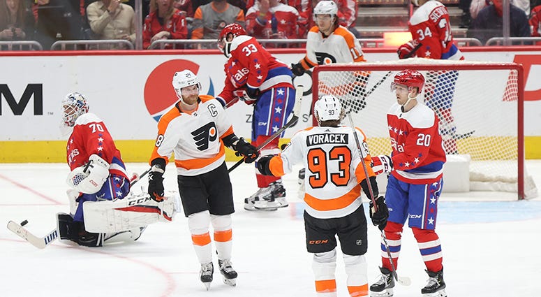 Claude Giroux celebrates scoring the Flyers' seventh goal of the night against Braden Holtby in the third period Braden Holtby continues his downward slide