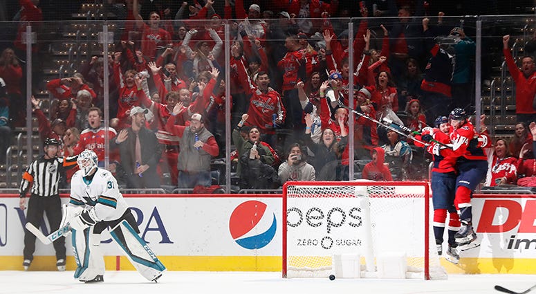 Lars Eller celebrates with John Carlson after scoring the OT game-winner after an improbable comeback against the San Jose Sharks 'No-quit mentality' fueled Caps' unfathomable comeback vs. Sharks