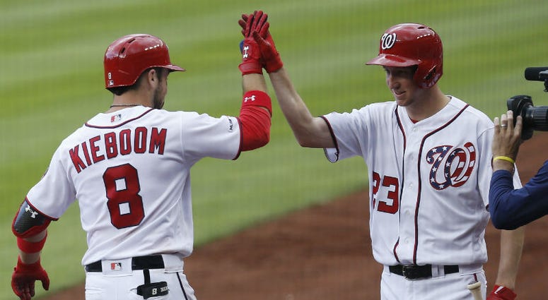 Carter Kieboom celebrates with Erick Fedde after hitting a solo home run in the fifth inning at Nationals Park Erick Fedde optioned back to Double-A after scoreless relief appearance