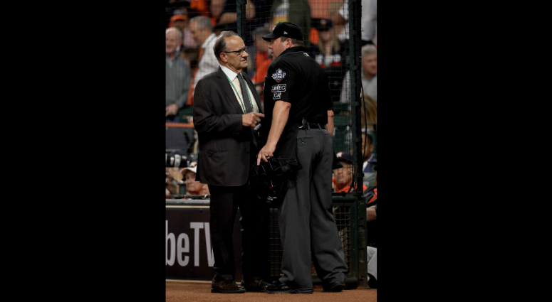 Joe Torre spoke to umpires after the call. Best pictures of World Series umpire controversy, Dave Martinez ejection