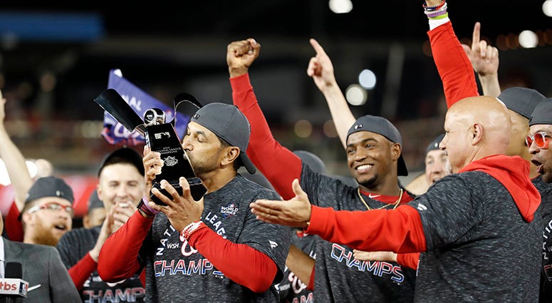 Nats manager Dave Martinez kisses the NLCS trophy Dave Martinez National League Pennant