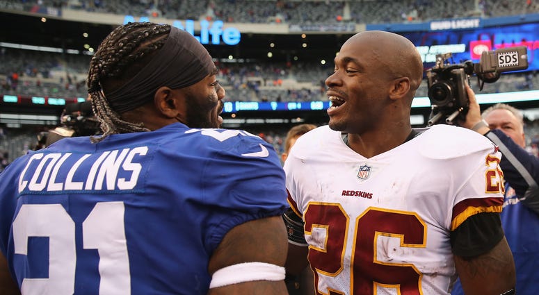 Giants safety Landon Collins talks with Redskins running back Adrian Peterson after an Oct. 2018 game. Collins makes perfect sense for Redskins, if he reaches free agency