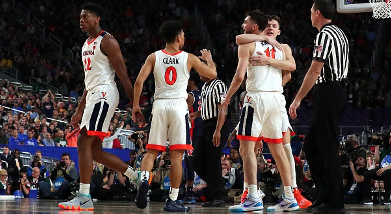 The Virginia Cavaliers celebrate during their Final Four win over Auburn. Virginia_Cavaliers