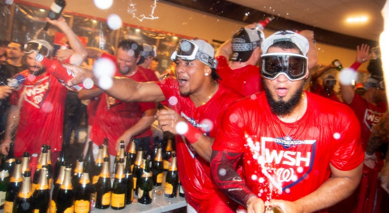 Nats pop bottles after Wild Card Game win. Photos: Stay in the fight! Nats beat Brewers in Wild Card