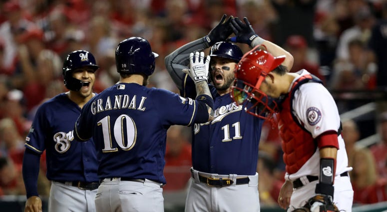Yasmani Grandal's 2-run HR put Nats down early in Wild Card Game. PHOTOS: Stay in the fight! Nats beat Brewers in Wild Card