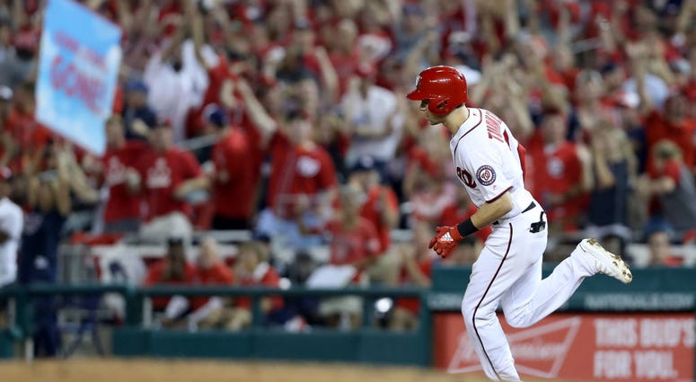 Trea Turner rounds bases after his Wild Card Game HR. PHOTOS: Stay in the fight! Nats beat Brewers in Wild Card