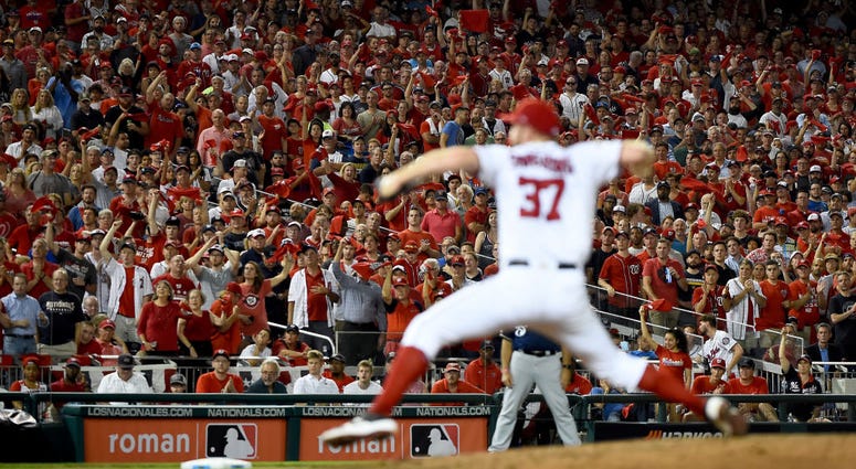 Stephen Strasbrug pitched three scoreless for Nationals. PHOTOS: Stay in the fight! Nats beat Brewers in Wild Card