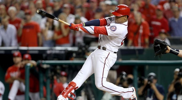 Juan Soto delievers three-run scoring single. PHOTOS: Stay in the fight! Nats beat Brewers in Wild Card