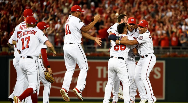Nationals celebrate 4-3 win over the Brewers. Photos: Stay in the fight! Nats beat Brewers in Wild Card