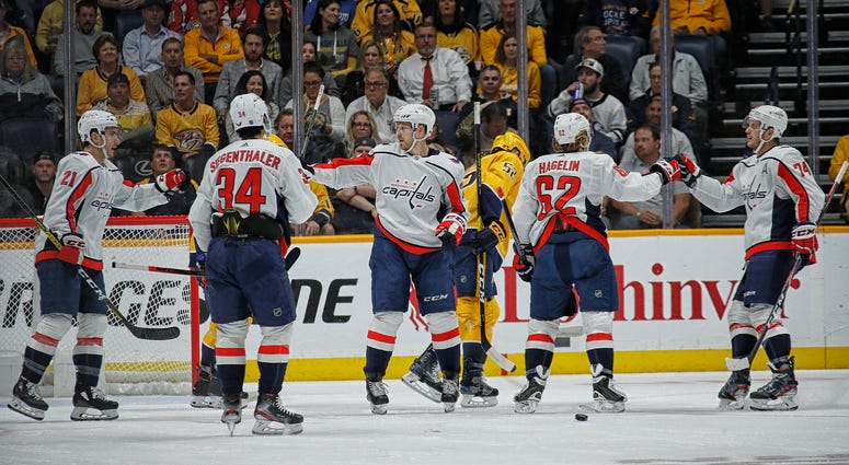 The Caps Dads trip looks like the best time. Garnet Hathaway, Jonas Siegenthaler, Carl Hagelin, and John Carlson of the Washington Capitals celebrate a goal.